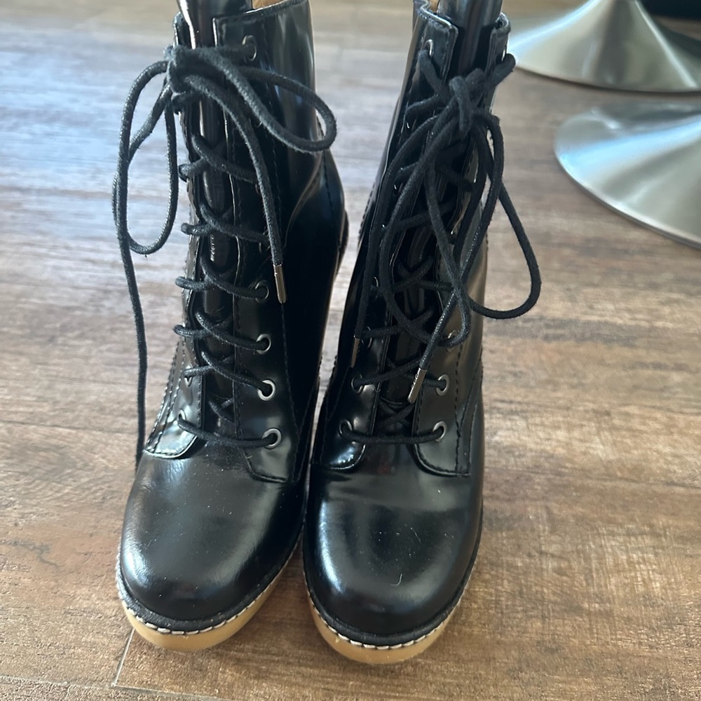 Black patent leather lace up boots. LAMB. 4 inch heels. Stylish!
